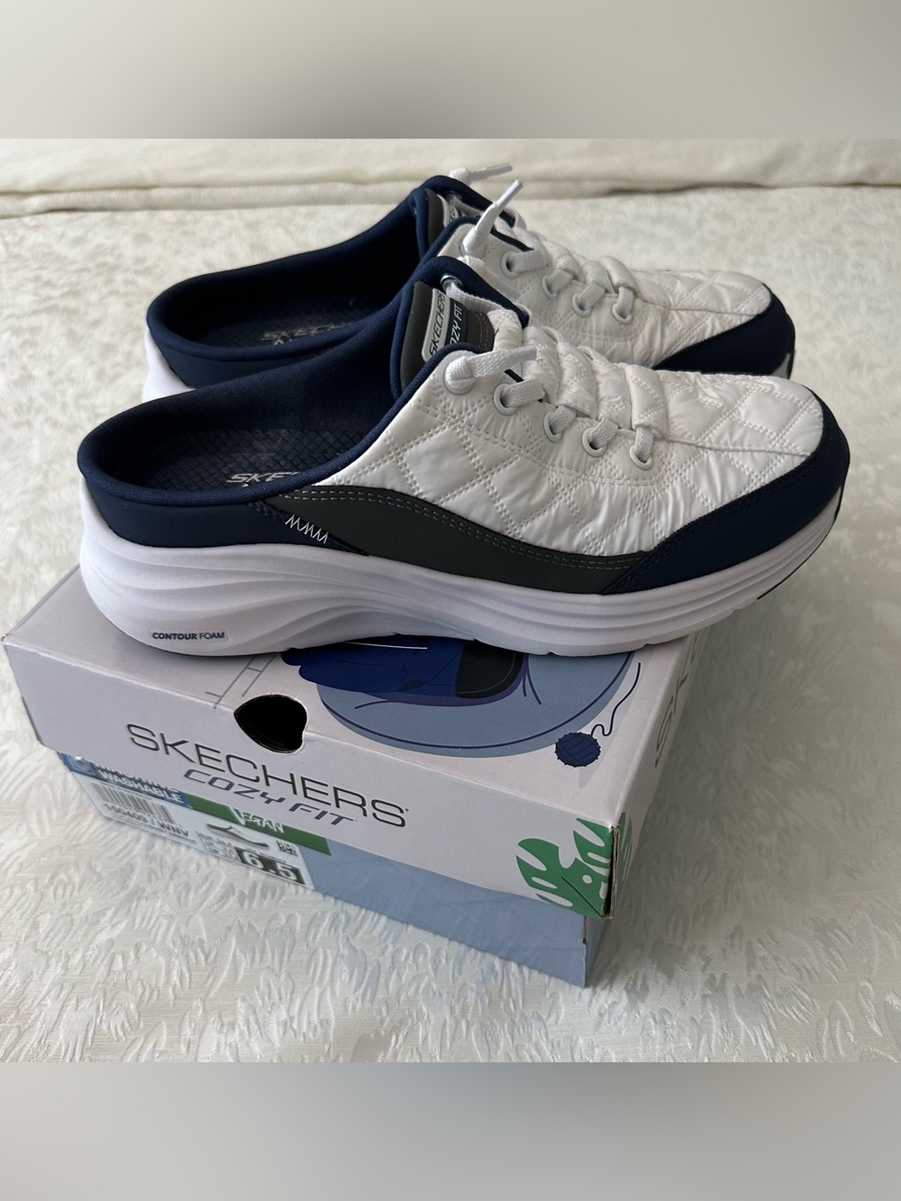 Skechers women's White and Navy Quilted Slip-On Sneakers